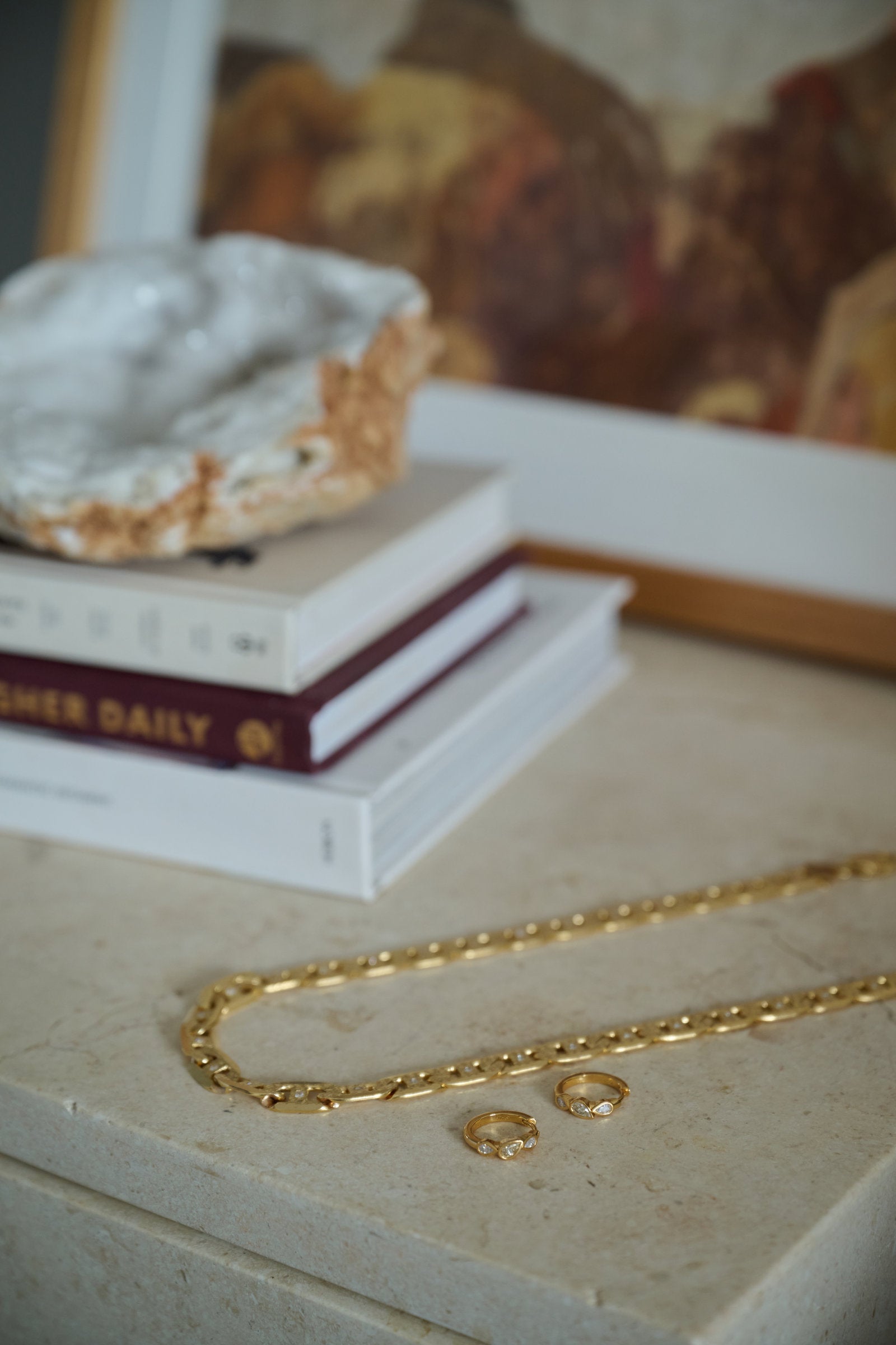 Valentino Chain Necklace links with white cubic zirconia, flatlay on stone
